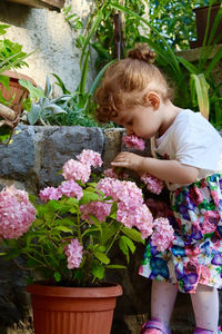 High angle view of girl standing amidst plants