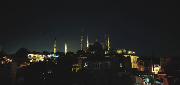 Illuminated buildings in city at night