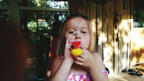 Close-up of girl playing with toy