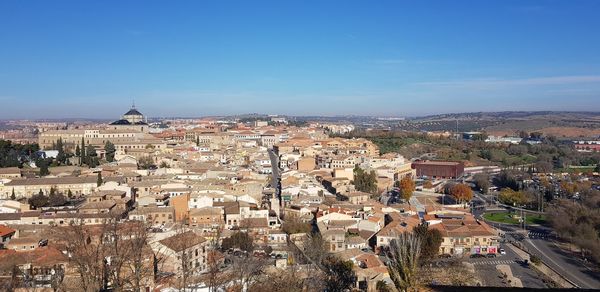 High angle view of townscape against blue sky