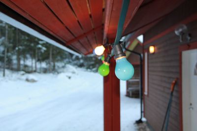 Close-up of snow on illuminated road during winter