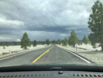 Empty road against sky, car view 