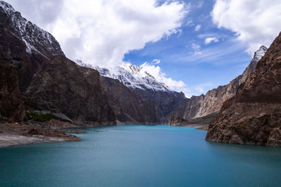 Scenic view of lake and mountains against sky