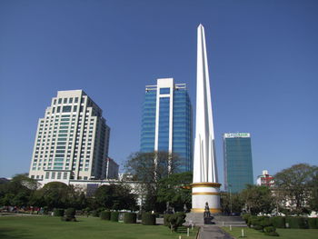 Low angle view of skyscrapers against clear sky