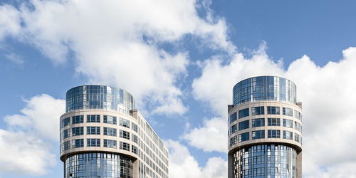 Low angle view of modern buildings against sky