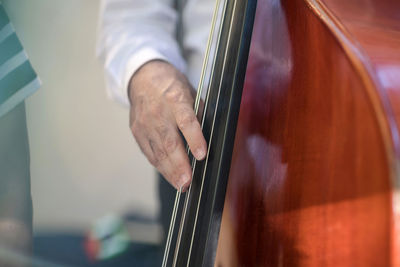 Midsection of man playing piano