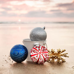 Close-up of christmas decoration at beach