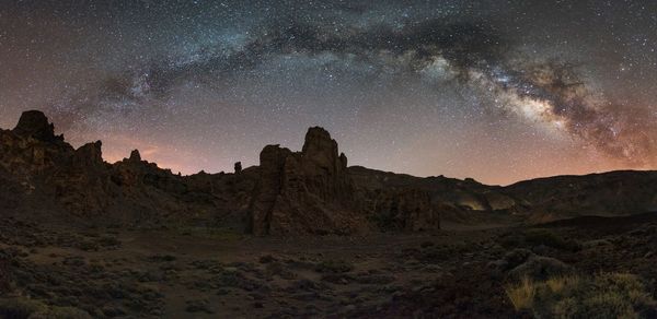 Scenic view of rock formations at night