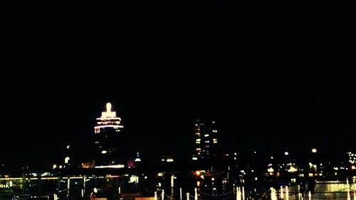 Illuminated buildings in city at night