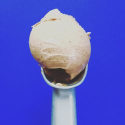 Close-up of ice cream against blue background