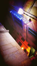 Low angle view of illuminated buildings at night