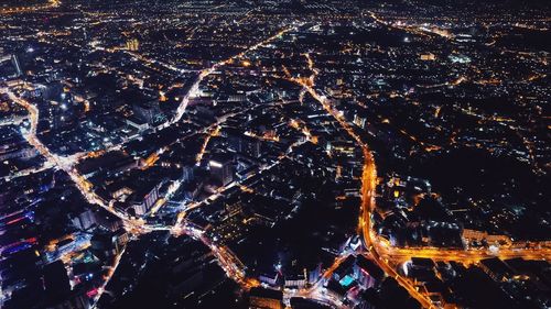 Aerial view of illuminated cityscape at night