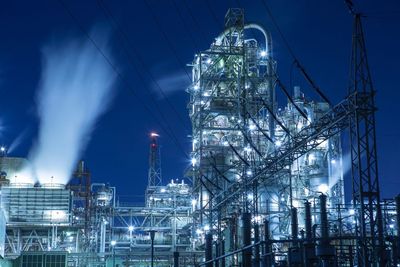 Illuminated refinery factory at night