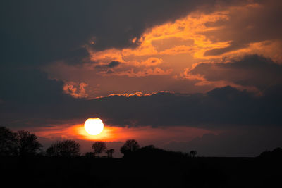 Scenic view of silhouette landscape against sky during sunset