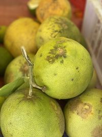 Close-up of green fruits for sale at market stall