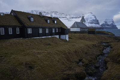 House on field against sky