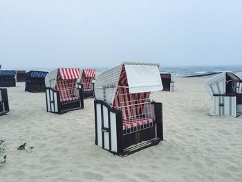 Lifeguard chair on beach against clear sky
