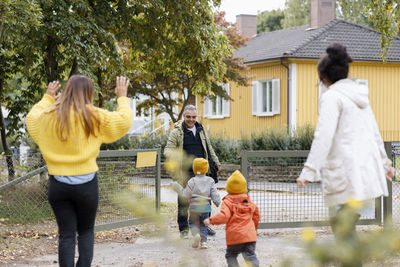 Family meeting each other outside