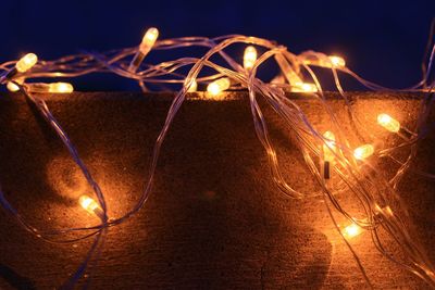 Close-up of illuminated lights at night