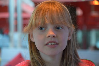 Close-up portrait of smiling young woman