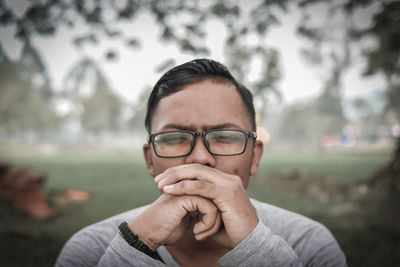 Portrait of man wearing eyeglasses