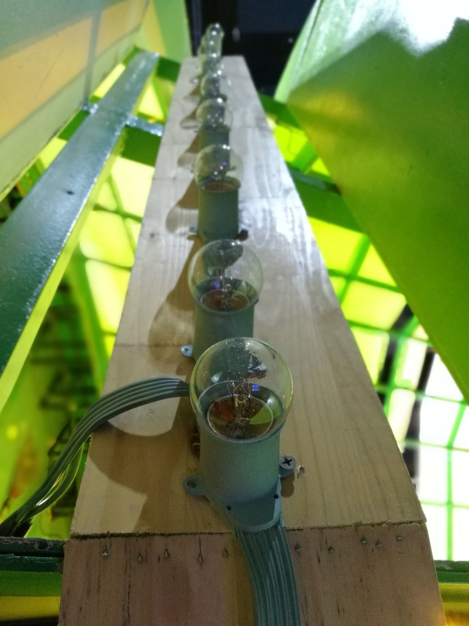 CLOSE-UP OF WATER BOTTLE WITH BOTTLES ON TABLE