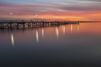 Scenic view of calm sea at sunset