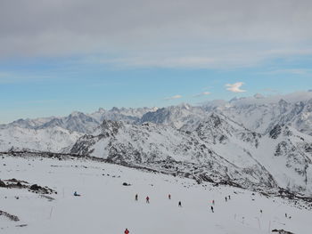 Scenic view of snowcapped mountains against sky