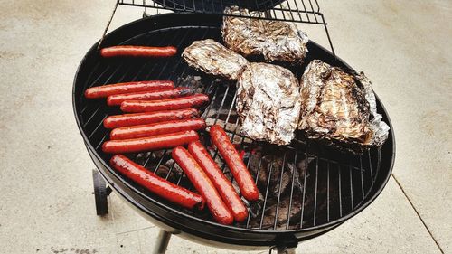 High angle view of meat on barbecue grill