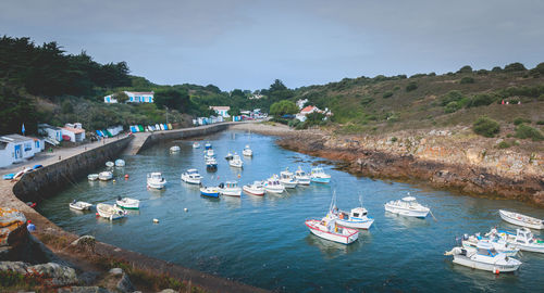 High angle view of boats in sea against sky