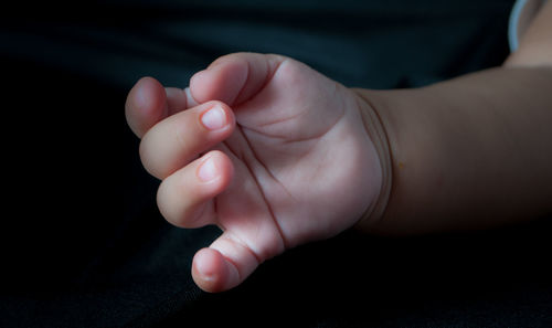Close-up of woman holding hands