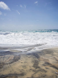 Scenic view of beach against sky