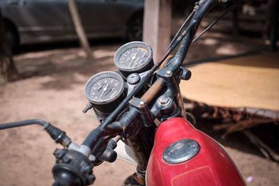 Close-up of motorcycle handlebar in city