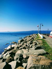 Scenic view of sea against clear blue sky