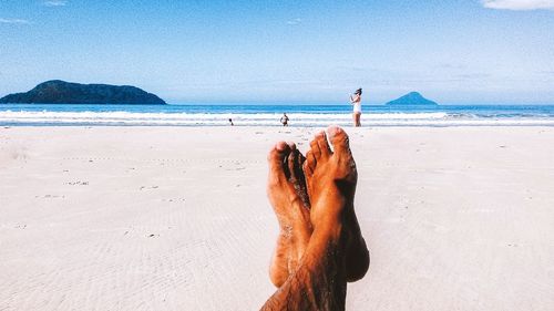 Man on beach against sky