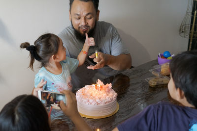 High angle view of family during birthday party