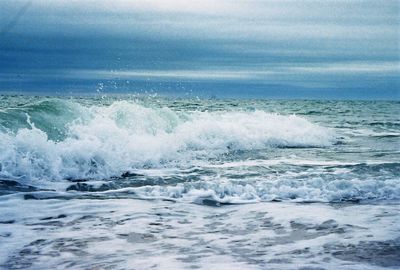 Waves breaking against sea