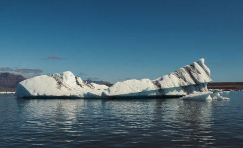 Huge glacier in calm northern sea landscape photo