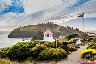 Scenic view of sea and buildings against sky