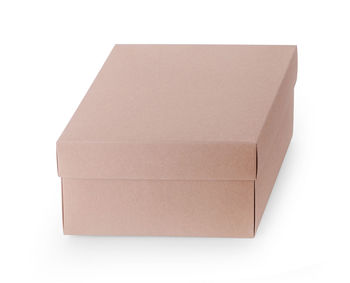 Close-up of paper box over white background