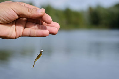 Close-up of hand holding water