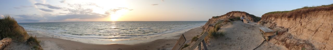 Panoramic view of sea against sky during sunset