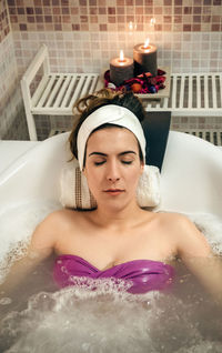 Young woman in bathtub