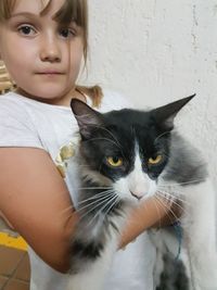 Portrait of girl with cat