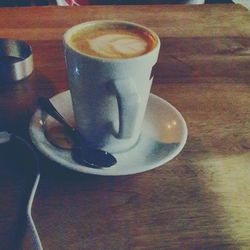 High angle view of coffee cup on table