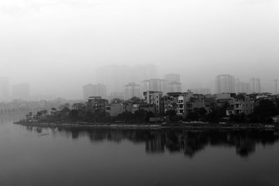 Reflection of cityscape in foggy weather