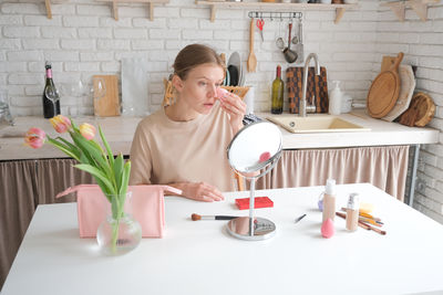 Midsection of woman preparing food on table