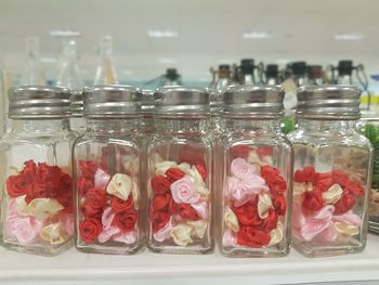 Close-up of red roses in jar