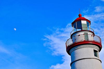 Low angle view of lighthouse against blue sky