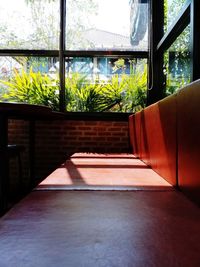 Potted plants on table by window